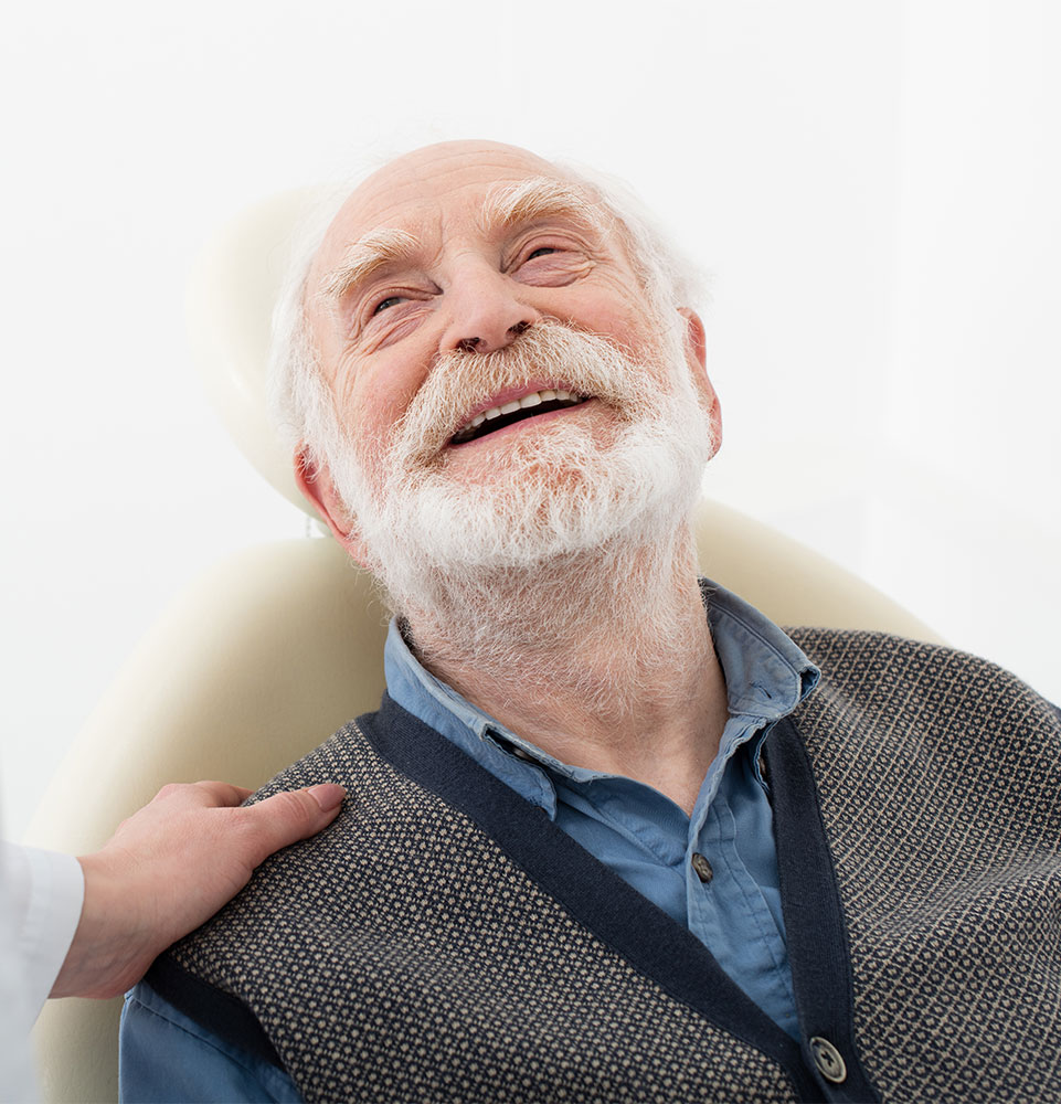 senior dental implant patient smiling