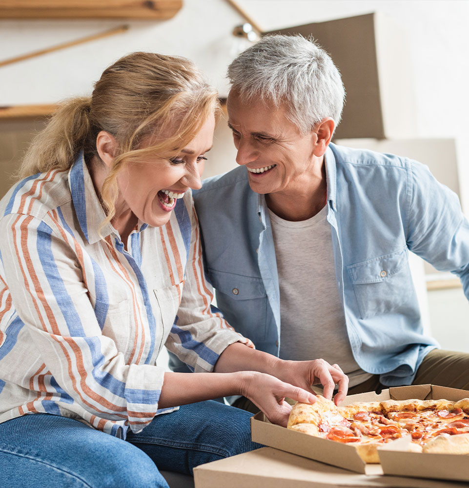 dental implant patients smiling and eating